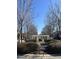 Picturesque street view featuring a charming pergola walkway and well-manicured landscaping at 5618 Wade Park Blvd, Raleigh, NC 27607