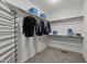 Organized walk-in closet with shelving, hanging rods, and carpeted floor, maximizing storage space at 5618 Wade Park Blvd, Raleigh, NC 27607