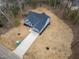 Aerial view of home with a long driveway and landscaping at 605 Shawnee Dr, Louisburg, NC 27549