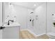 Modern bathroom featuring a marble shower, wood-look floor, and sleek fixtures at 605 Shawnee Dr, Louisburg, NC 27549