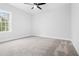 Bedroom with neutral carpet, ceiling fan, and bright window at 605 Shawnee Dr, Louisburg, NC 27549