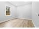 Bright bedroom featuring hardwood floors, natural light from the single window at 605 Shawnee Dr, Louisburg, NC 27549