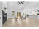 Bright open living area with a fireplace, light-colored floors, and ample natural light from sliding glass doors at 605 Shawnee Dr, Louisburg, NC 27549