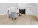 Living room with a fireplace, built-in shelving, and hardwood floors at 605 Shawnee Dr, Louisburg, NC 27549