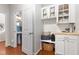 A mudroom features built-in shelving, a bench, and a countertop, with a half-bathroom located nearby at 617 Hope Valley Rd, Knightdale, NC 27545