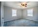 Bedroom boasts new paint, two windows, carpet flooring and ceiling fan at 623 Rolling Rd, Haw River, NC 27258