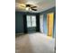 Spacious bedroom with carpet, ceiling fan, and natural light from the window at 6520 Thetford Ct, Raleigh, NC 27615