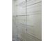 Walk-in closet featuring adjustable wire shelving for easy storage at 6520 Thetford Ct, Raleigh, NC 27615