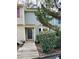Charming two-story townhome with a rustic wooden walkway to the front door at 6520 Thetford Ct, Raleigh, NC 27615