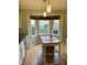 Updated kitchen featuring white cabinets, stainless steel appliances, and a kitchen island at 6520 Thetford Ct, Raleigh, NC 27615