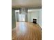 Spacious living room with hardwood floors, fireplace, and sliding glass doors at 6520 Thetford Ct, Raleigh, NC 27615