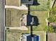 Aerial view of the house and backyard showing mature landscaping, driveway, and sidewalk at 654 Christian Light Rd, Fuquay Varina, NC 27526