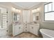 Bright bathroom features double vanity and a soaking tub at 654 Christian Light Rd, Fuquay Varina, NC 27526