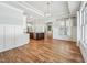 Bright dining room with paneled walls and large window overlooking the yard provides ample natural light at 654 Christian Light Rd, Fuquay Varina, NC 27526