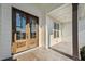 Close-up of the wooden front door with glass panes and a covered porch, adding a touch of elegance at 654 Christian Light Rd, Fuquay Varina, NC 27526