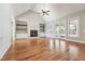 Inviting living room with fireplace, French doors to a deck, hardwood floors and built-in shelves at 654 Christian Light Rd, Fuquay Varina, NC 27526
