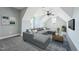 Bright living room featuring vaulted ceiling, fan, window, and a sectional couch with a decorative carpet at 654 Christian Light Rd, Fuquay Varina, NC 27526