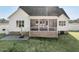 An outdoor living area features a screened porch with a ceiling fan and outdoor dining at 654 Christian Light Rd, Fuquay Varina, NC 27526
