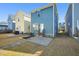 Blue house backyard featuring a patio and landscaping bed at 781 Fireball Ct, Knightdale, NC 27545