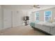 Bedroom featuring neutral walls, carpeting, ceiling fan, and two windows at 781 Fireball Ct, Knightdale, NC 27545