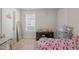 Cozy bedroom featuring carpet floors, a window, and a Hello Kitty themed bed at 781 Fireball Ct, Knightdale, NC 27545