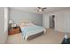 Bedroom with a gray accent wall, carpet, and a comfortable bed with decorative pillows at 781 Fireball Ct, Knightdale, NC 27545