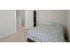 Bedroom featuring neutral walls, carpeting, and a bed with patterned comforter at 781 Fireball Ct, Knightdale, NC 27545