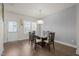 Bright dining room with hardwood floors and large windows at 781 Fireball Ct, Knightdale, NC 27545