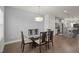 Open dining area adjacent to kitchen features hardwood floors at 781 Fireball Ct, Knightdale, NC 27545