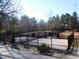 Community dog park with fenced enclosure and mature trees in the background at 781 Fireball Ct, Knightdale, NC 27545