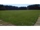 Large community field with lush green grass perfect for sports and recreation at 781 Fireball Ct, Knightdale, NC 27545