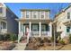 Charming two-story home with inviting front porch and landscaped yard at 781 Fireball Ct, Knightdale, NC 27545