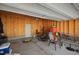 Unfinished garage featuring a concrete floor, overhead door, and ample storage at 781 Fireball Ct, Knightdale, NC 27545