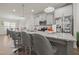Spacious kitchen features a large island with granite countertops and stainless steel appliances at 781 Fireball Ct, Knightdale, NC 27545