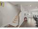 Carpeted staircase with white railing at 781 Fireball Ct, Knightdale, NC 27545