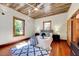 Bright bedroom features beautiful hardwood floors, a unique ceiling, and natural light at 807 Vickers Ave, Durham, NC 27701