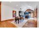 Bright dining area with hardwood floors and modern light fixtures that flows into the kitchen at 807 Vickers Ave, Durham, NC 27701