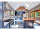 Modern kitchen with custom cabinetry, stainless steel appliances and a center island with breakfast bar at 807 Vickers Ave, Durham, NC 27701