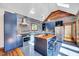 Beautiful kitchen with stainless steel appliances, custom cabinetry, and lots of natural light, perfect for cooking at 807 Vickers Ave, Durham, NC 27701