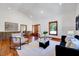 Bright living room with hardwood floors, modern decor and an open design perfect for entertaining at 807 Vickers Ave, Durham, NC 27701