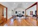 Spacious living room featuring high ceilings, hardwood floors, stylish furniture and an open design at 807 Vickers Ave, Durham, NC 27701