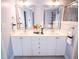 Elegant bathroom with double vanity, decorative mirrors, and great lighting at 8607 Eagle View Dr, Durham, NC 27713