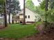 Backyard with a deck and views of serene, wooded surroundings, offering a peaceful outdoor space at 904 Amersham Ln, Wake Forest, NC 27587
