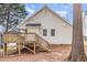 Exterior view of the home with a new wooden deck and serene backyard at 904 Amersham Ln, Wake Forest, NC 27587