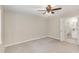 Neutral bedroom with access to ensuite bathroom, ceiling fan and carpet at 904 Amersham Ln, Wake Forest, NC 27587
