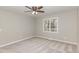 Cozy bedroom with carpet, neutral walls, ceiling fan and a large window at 904 Amersham Ln, Wake Forest, NC 27587