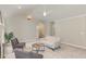 Airy living room featuring vaulted ceiling and neutral colors to create a serene atmosphere for relaxing and entertaining at 904 Amersham Ln, Wake Forest, NC 27587