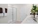Bathroom featuring a walk-in shower, double vanity, and elegant decor at 93 Fair Child Rd, Spring Lake, NC 28390