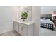 Bathroom featuring a double vanity, modern fixtures, and elegant floral arrangement at 93 Fair Child Rd, Spring Lake, NC 28390