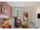 Bright Bedroom featuring a crib, cozy rocking chair, and cheerful decor accents at 93 Fair Child Rd, Spring Lake, NC 28390